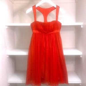 A gorgeous vibrant oranges red Versace silk dress